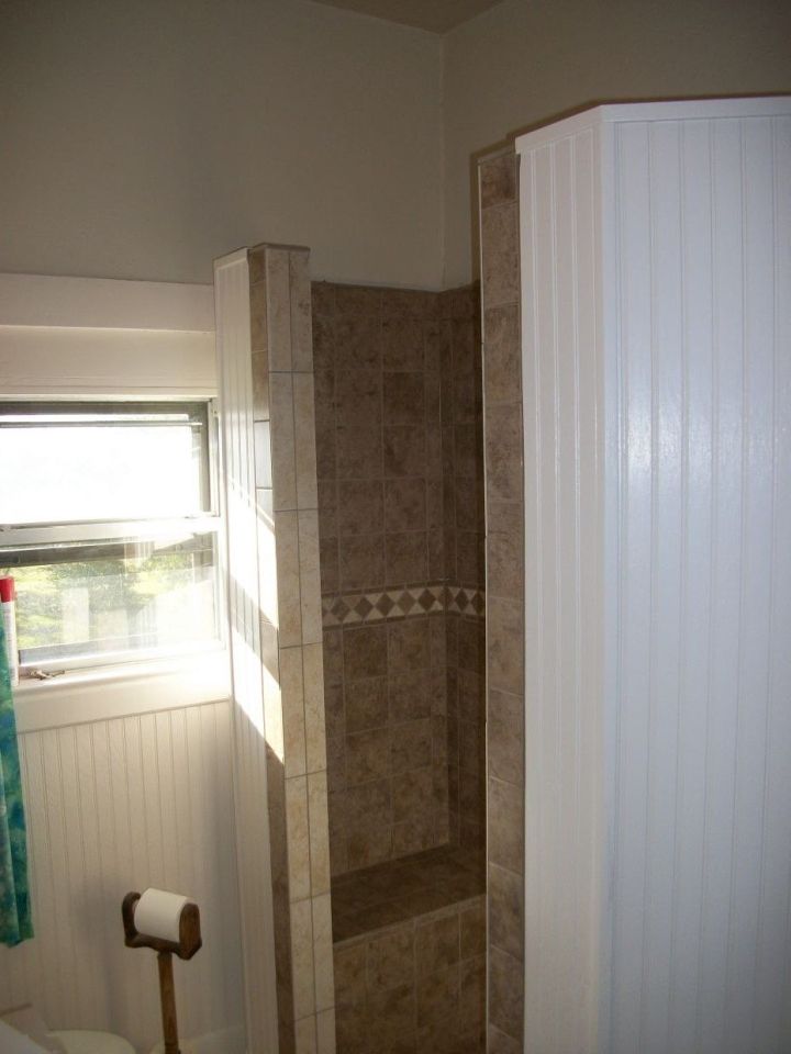 farmhouse shower with beadboard on outside wall